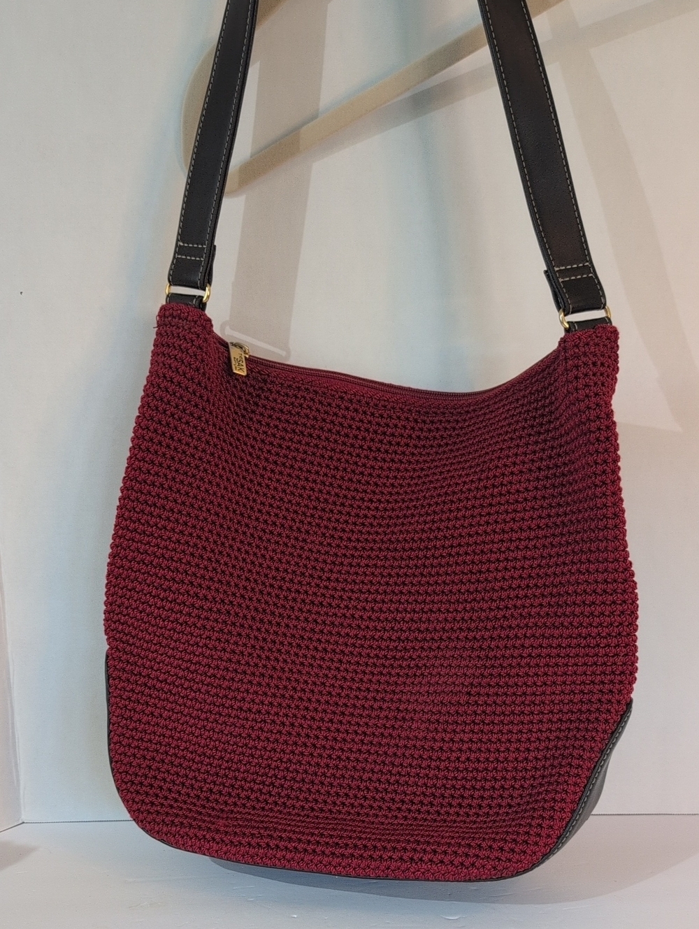 The Sak Women's Crochet Shoulder Bag in Crimson And Brown Faux Leather